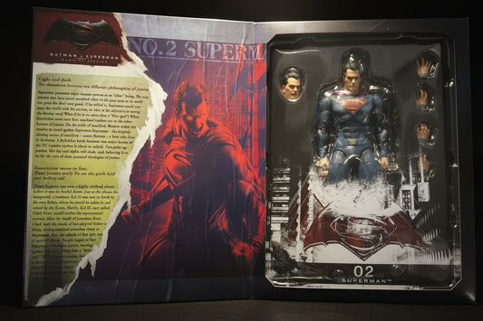 Batman v Superman: Dawn of Justice No. 2 Superman action figure in its original window box packaging, showing the figure, interchangeable heads, and printed comic-style insert card.