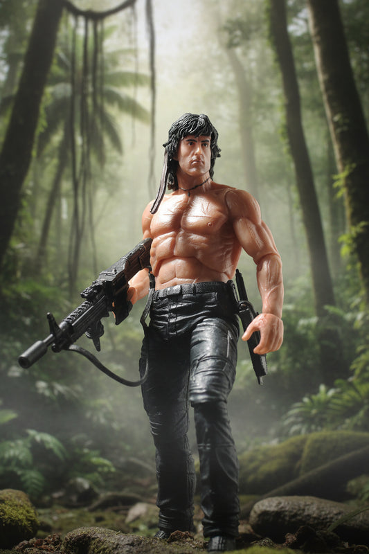 A highly detailed action figure of a shirtless muscular man with black hair, wearing black pants, posed dynamically against a dark gray studio background.